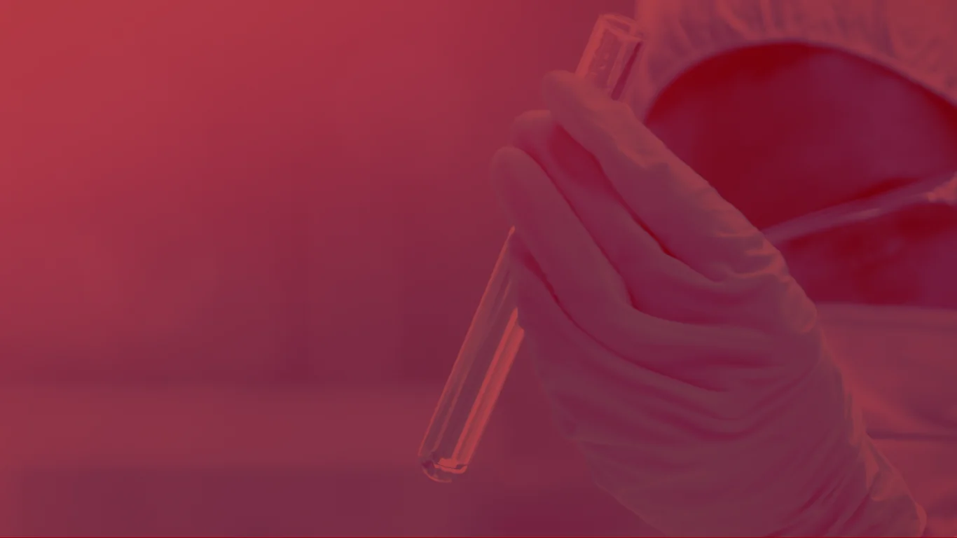 Scientist examining a test tube, official Rebel Medicine photography